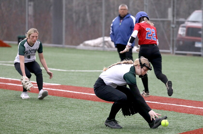 Proctor’s Maddy Walsh (7) fields a bunt by Moose Lake’s Maci Kukuk (22)