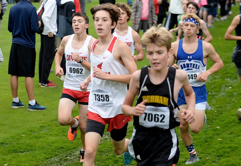 Willmar junior Matthew Eystad, 7358, keeps up with the pack at the start of the Willmar Invitational on Saturday, Oct. 1, 2022 at Eagle Creek Golf Club in Willmar.