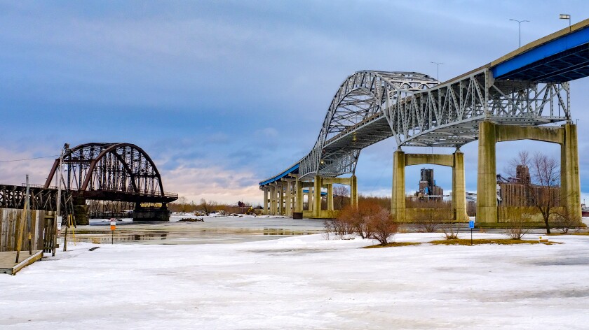 The Blatnik Bridge (right) and remains of its predecessor the Interstate Bridge as seen from Rice's Point in Duluth Thursday evening. Clint Austin / caustin@duluthnews.com