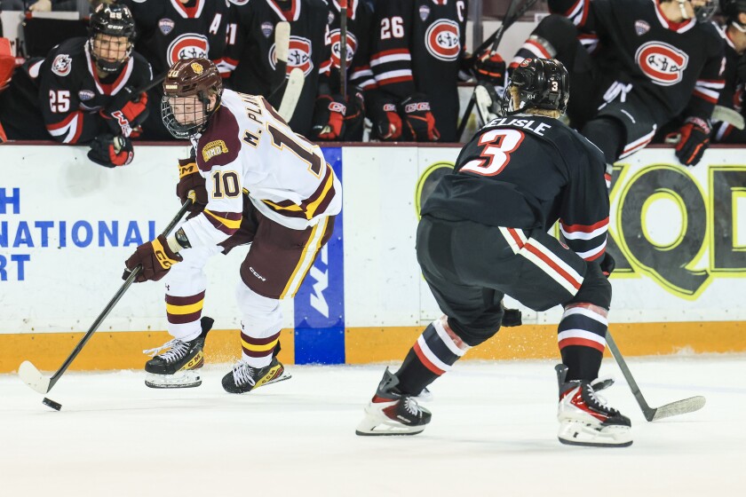 college men play ice hockey