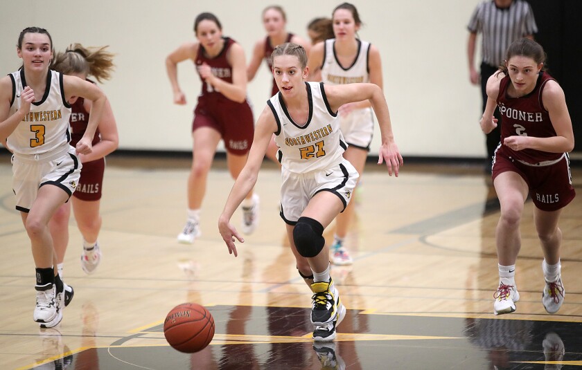 Northwestern’s Shayna Wick (21) leads the break after stealing the ball near half court