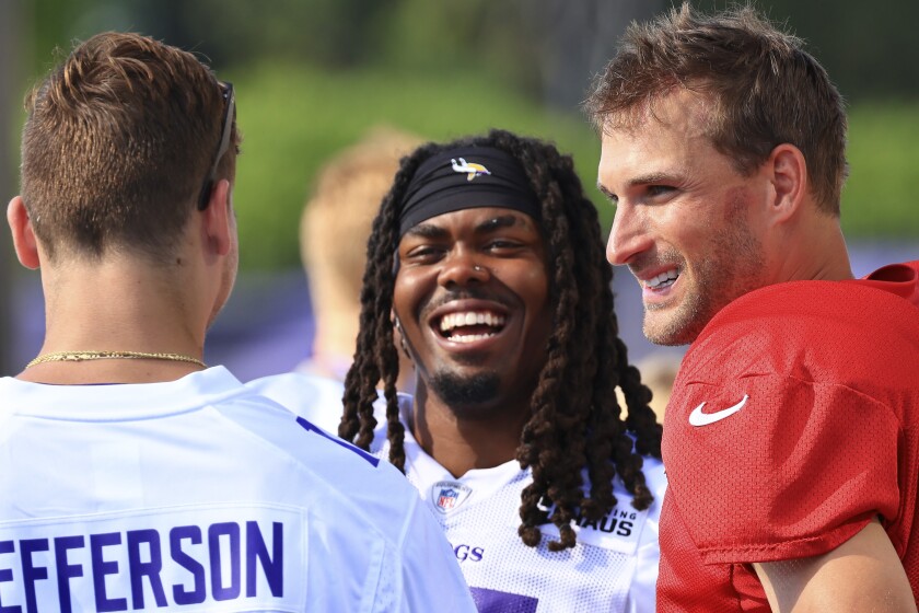 Professional football players practice at outdoor field