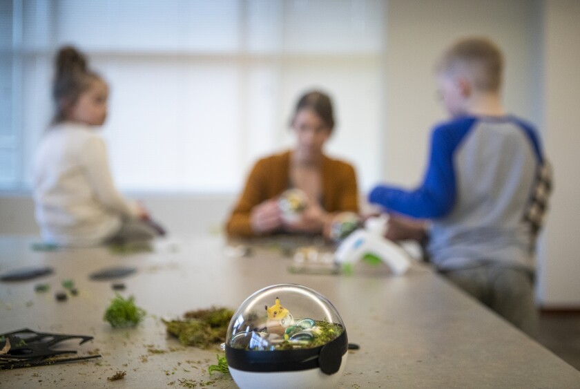 A finished Pokémon terrarium for Pikachu sits on a Willmar Public Library table as families gathered to build dozens of the tiny homes for their Pokémon Thursday, March 31, 2022.