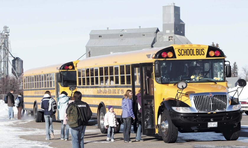 Bus driver Wes Mikkelsen greets his passengers