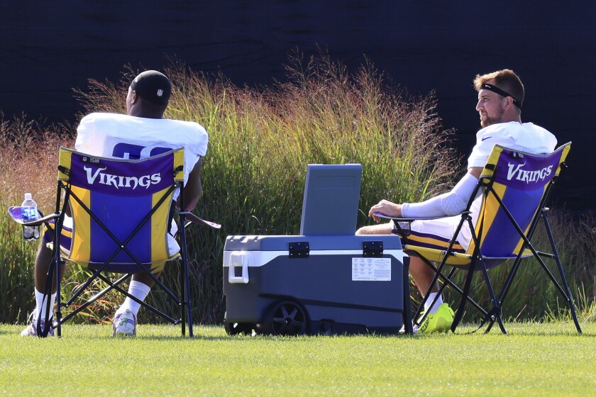 Professional football players practice at outdoor field