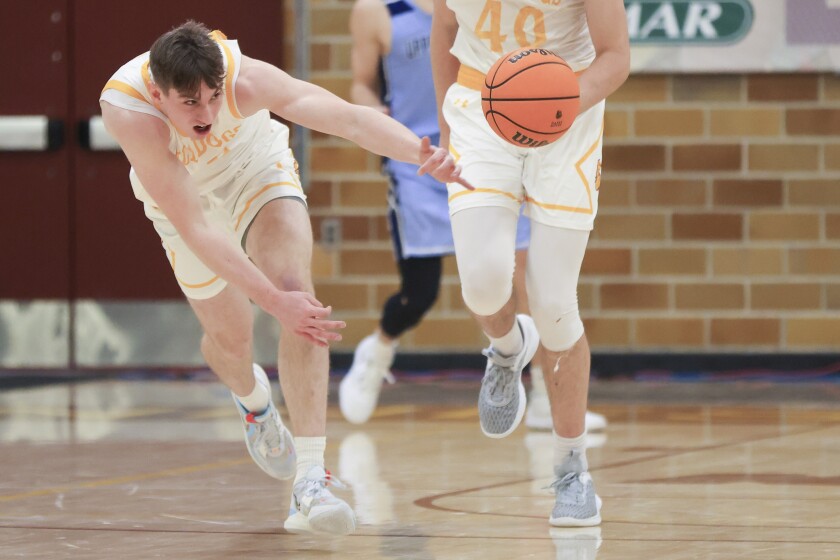College men play basketball