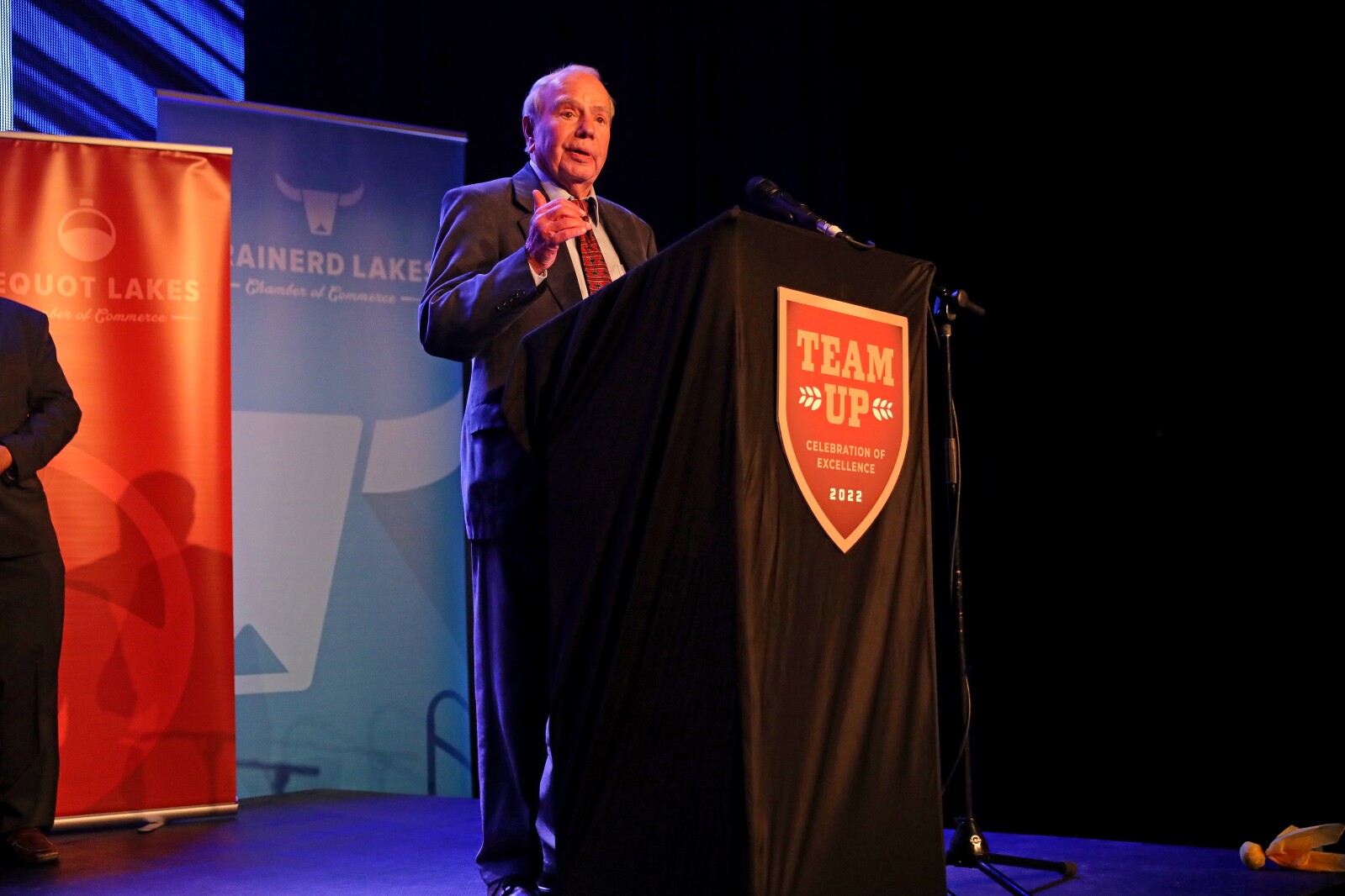 Bob Spizzo comes up on stage to accept the Business Legacy Award during the ninth-annual Brainerd Lakes Chamber of Commerce Celebration of Excellence award dinner Nov. 17, 2022, at Cragun's Resort on Gull Lake near Brainerd.