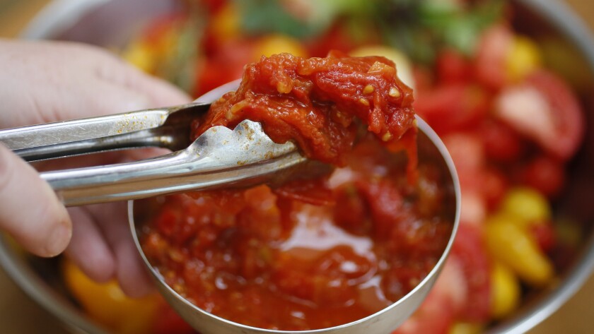 Fresh garden tomatoes are stewed while making Red Wine Garden Tomato Sauce. Michael Vosburg / Forum Photo Editor