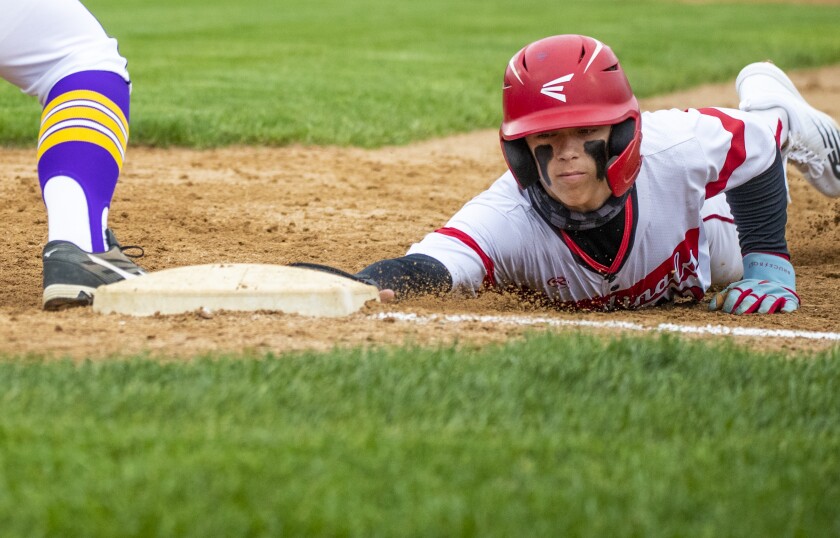 Willmar Cardinals senior Ian Koosman slides back to first to avoid being picked off during a game against the Little Falls Flyers at the Green Lakes Baseball Diamonds in Spicer on Tuesday, May 31, 2022.