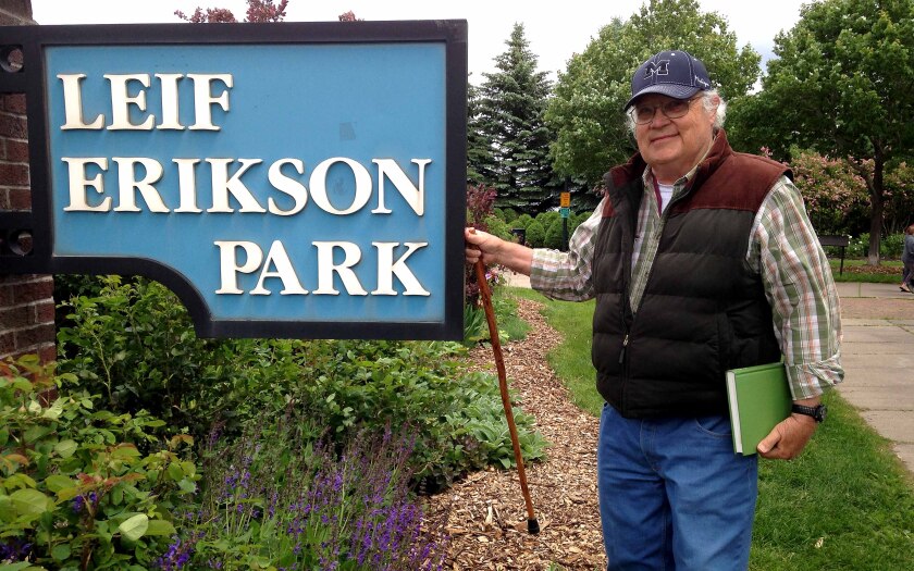 man standing by Leif Erikson Park sign