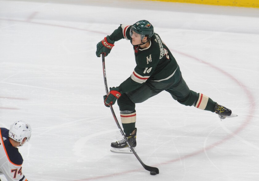 Minnesota Wild center Mikael Granlund (64), forward Zach Parise (11) and defenseman Matt Dumba (24) celebrate the goal by Parise during the first period against the Edmonton Oilers at Xcel Energy Center. Marilyn Indahl / USA TODAY Sports