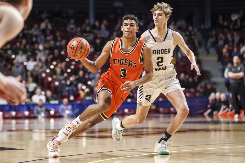 high school boys play basketball
