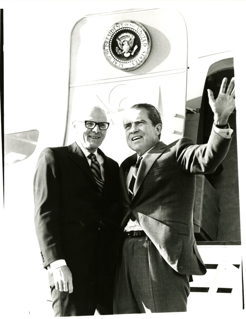 Nixon and Thomas Kleppe wave from the stairs on Air Force One.jpg