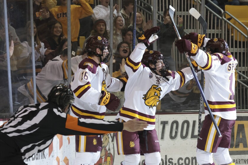 college men play hockey