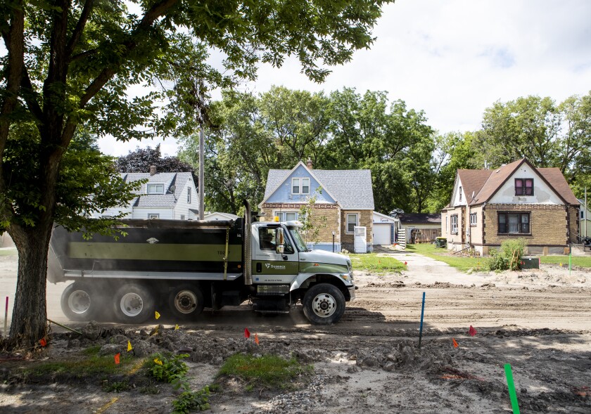 A diver for Duininck hauls away dirt along Charlotte Street SE road construction in Willmar on Tuesday, August 16, 2022.
