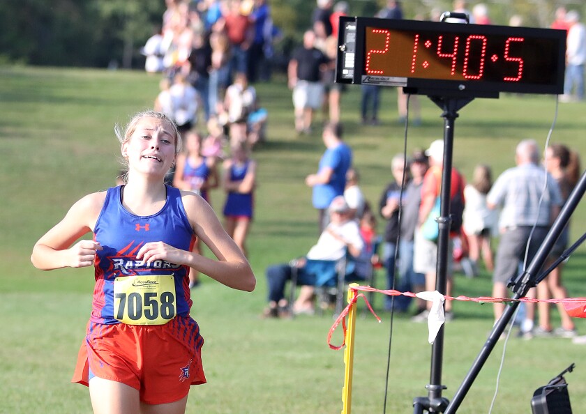 Wrenshall-Carlton’s Brielle Simula (7058) gets emotional as she crosses the finish line in third place