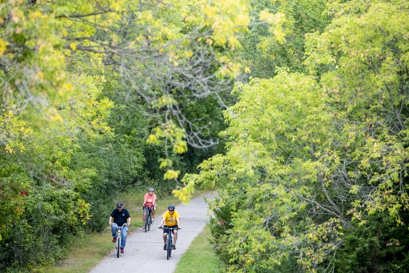 Cyclist ride along the Glacial Lakes State Trail while participating in the Mayor;s Bike Ride on Friday, September 16, 2022.