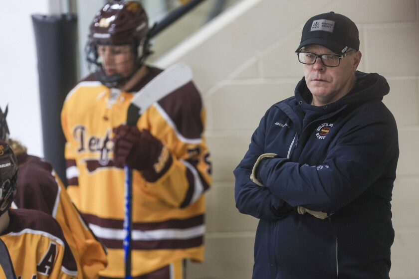 high school boys play hockey