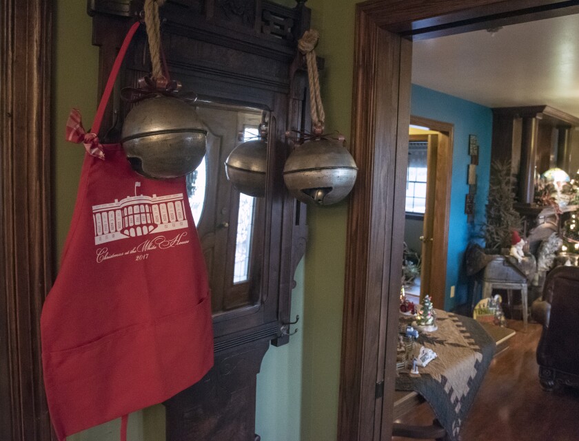 The apron Jeremy Jansen wore while decorating at the White House hangs up on a coat rack in his family's house just south of Emery after returning home from Washington D.C. for Thanksgiving. (Matt Gade / Forum News Service)
