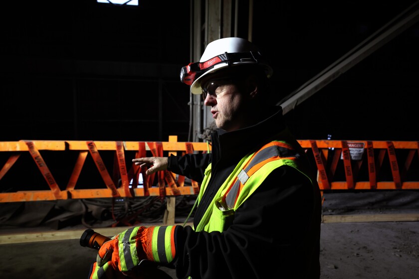 Man gives a tour of retired pellet plant