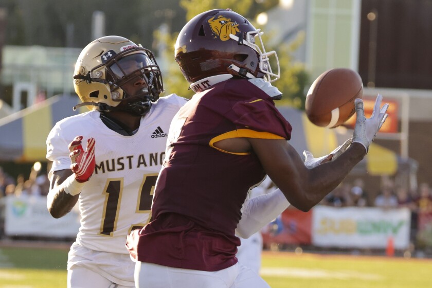 Football player playing in outdoor stadium