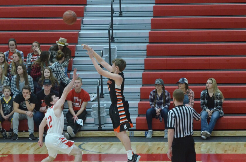 Killdeer junior guard Jamie Keller fires a shot from the corner against Dickinson Trinity during the opening game of the Roughrider Tournament on Tuesday, Dec. 11, from the Knights of Columbus Activities Center. (Patrick Bernadeau/The Dickinson Press)