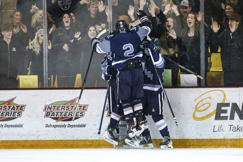 high school boys play ice hockey