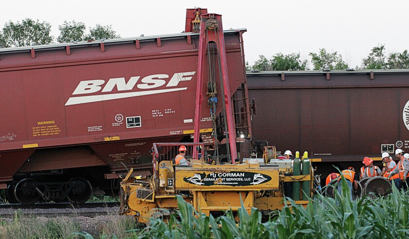 Workers with RJ Corman Derailment Services, LLC, respond to an incident Tuesday night near the CHS Farmers Alliance grain elevator in Mitchell. No other information was immediately available. (Caitlynn Peetz/Repbulic)