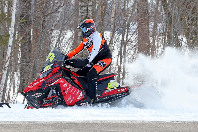 Snowmobilers race