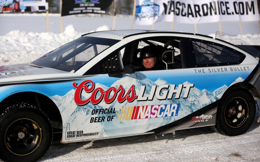 Barry Sinex sits in a retired NASCAR Cup Series car 