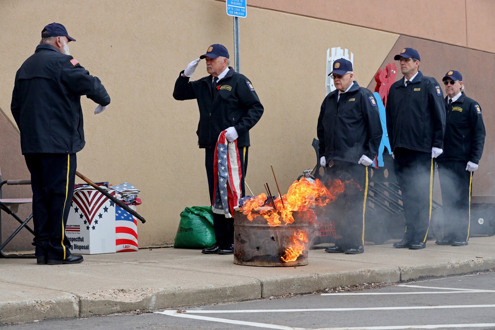 Retiring the flag with grace and dignity, the Brainerd Honor Guard performs a flag ceremony that involves burning old and damaged flags in a respectful manner.