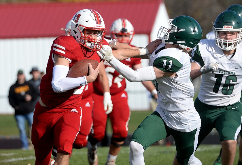 110121.S.WCT.Willmar FB Schramm stiff arm (1).jpg