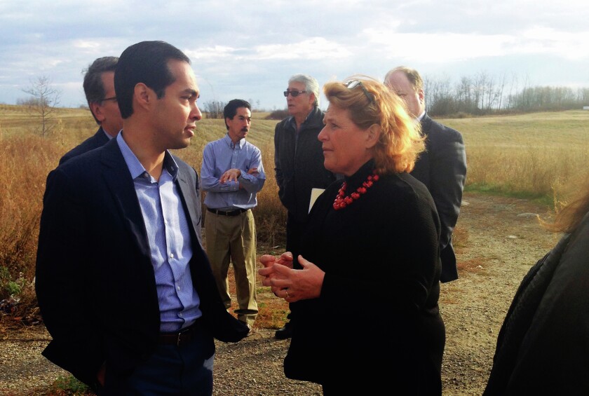 U.S. Housing and Urban Development Secretary Julian Castro, left, visits with Sen. Heidi Heitkamp, D-N.D., during a 2014 tour of housing needs in Indian Country. Special to Forum News Service