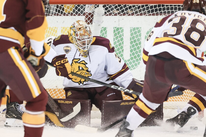 college men play ice hockey