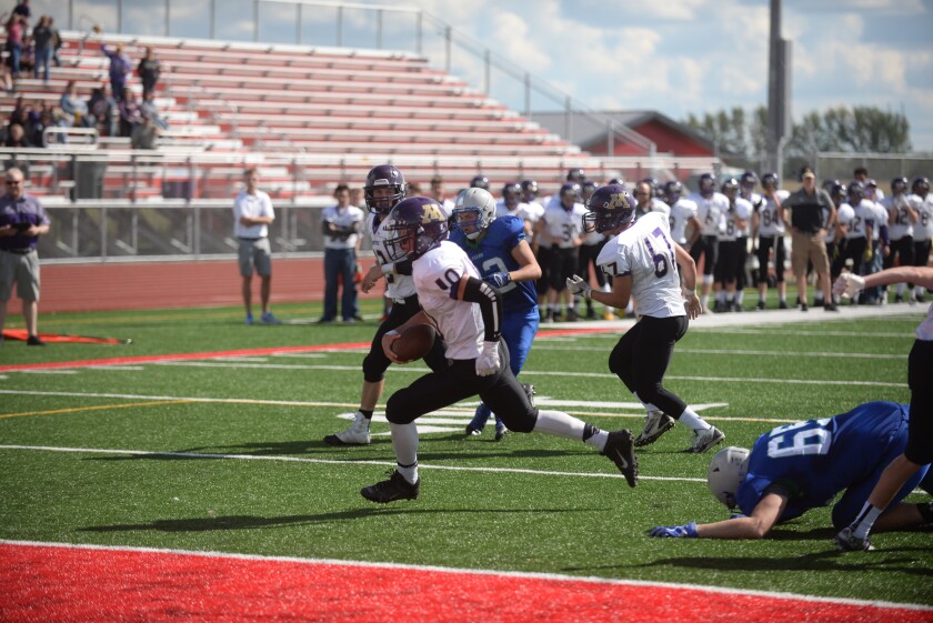 Montevideo's Isaac Douglas scampers in for a touchdown in the T-Hawks 13-8 win over Montevideo on Saturday in Alexandria. Jake Schultz / Tribune