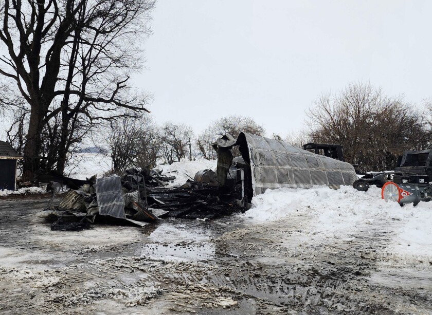 The aftermath of a machine shed burning down in rural Worthington Thursday, Dec. 29, 2022.