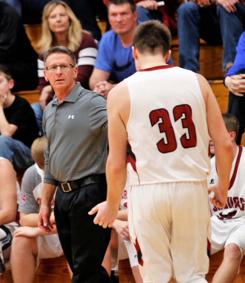 Corsica-Stickney coach Mike Tuschen talks with Hayden Plamp on Friday at Corsica. Tuschen won his 500th career coaching victory during the game. (Ryan Deal / Republic)
