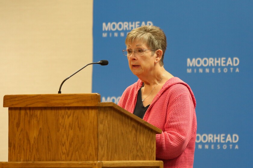 Mavis Tjon speaks during a Moorhead City Council meeting at the Hjemkomst Center on Monday, Aug. 11, 2025, about aerial spraying for mosquitoes. The city was supposed to spray for mosquitoes. The city postponed spraying after residents spoke out against it.
