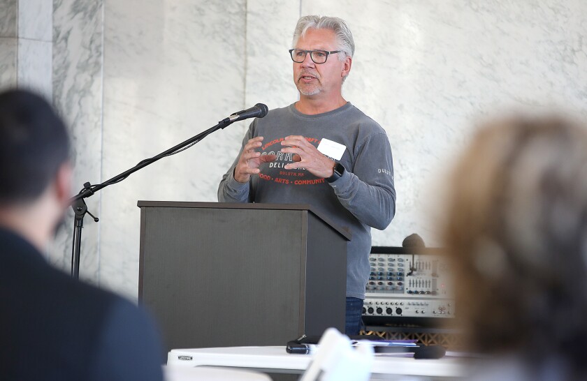 Speaker talks at podium.