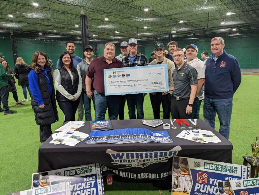 Cool 103.5 donates $5,000 to Brainerd-Baxter Baseball Association.