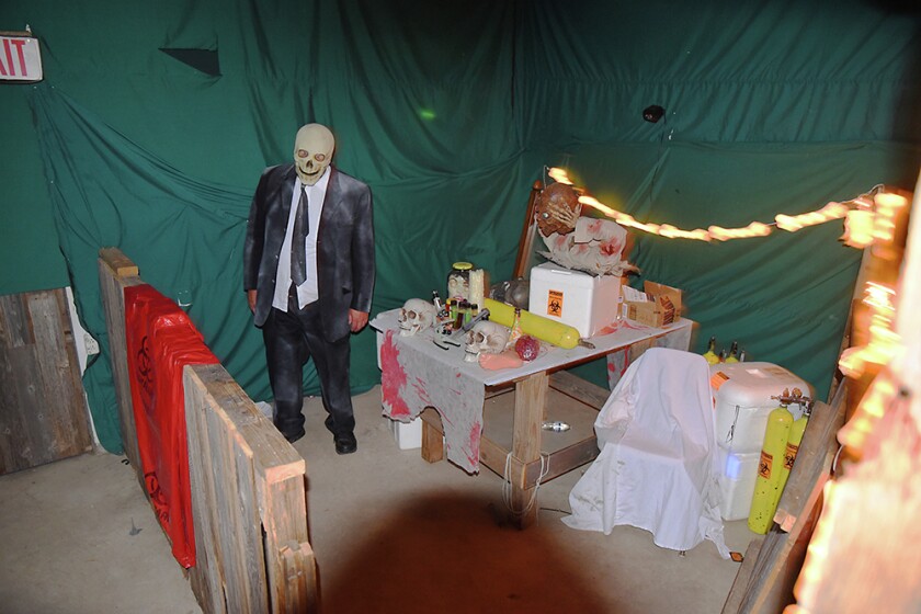 Briana Sanchez / TribuneDaniel Schanus, president of the Willmar Nite Lions, waits to scare people in the Deegers Freak Show haunted house Sunday night. The haunted house was put on by the Willmar Noon and Nite Lions. Regular admission is $10. Admission is $8 with the donnation of a canned food item for the Willmar Area Food Shelf.