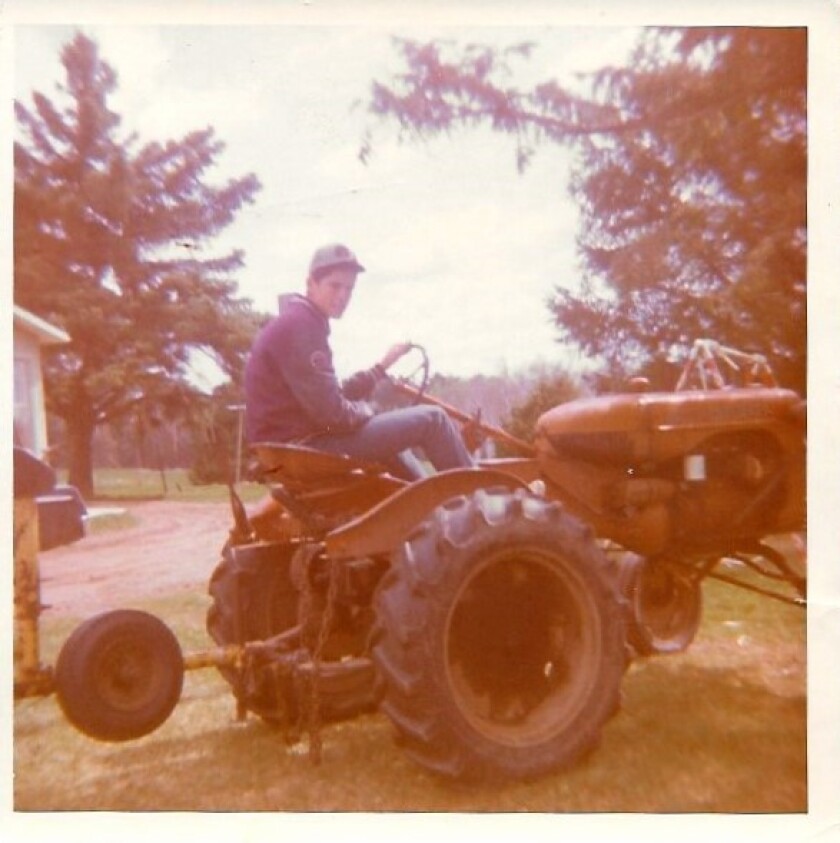Photo-Loren Else - on tractor with letter jacket.jpg