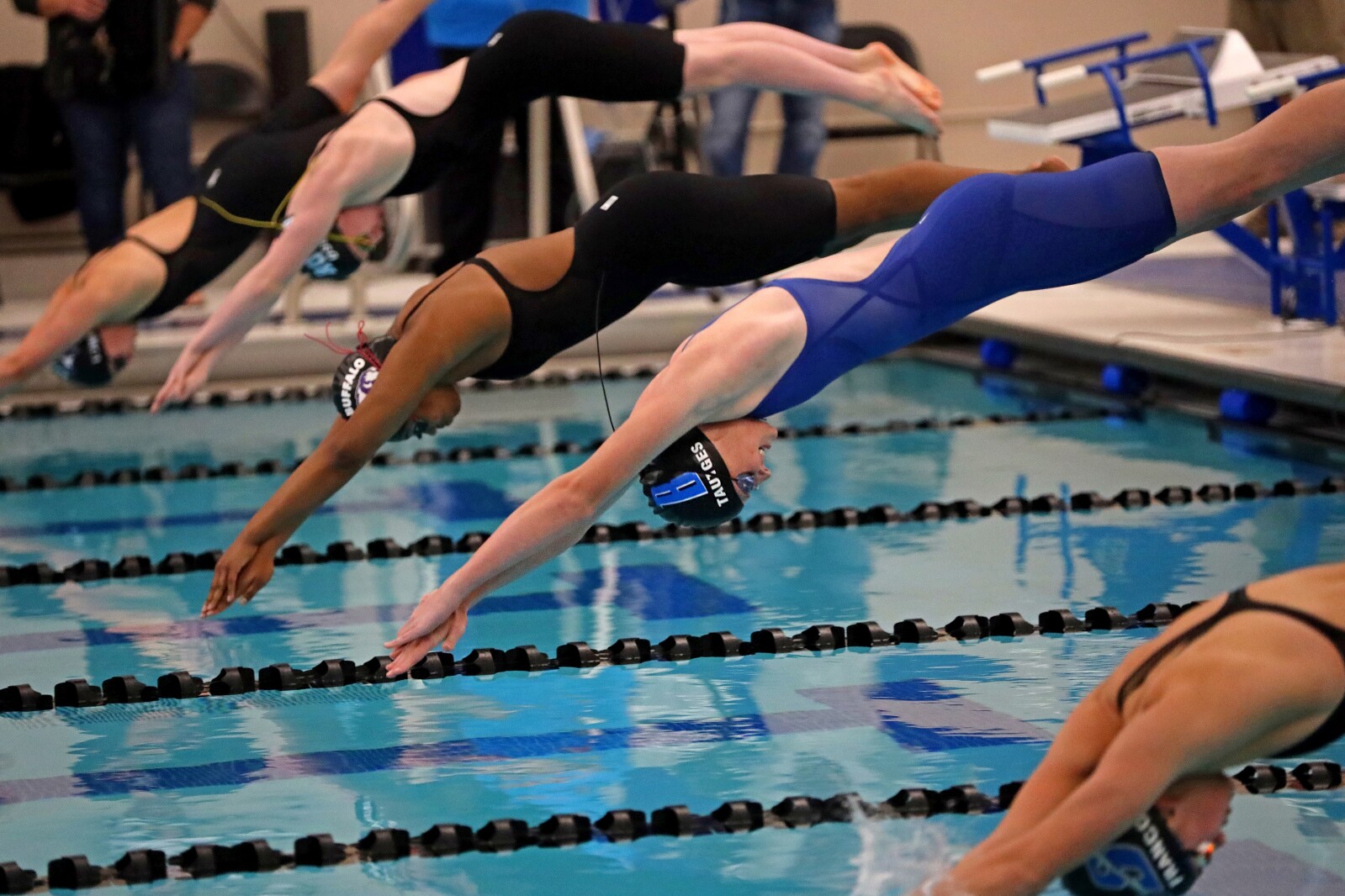 Mya Tautges dives into the water at the beginning of the 50 freestyle during the Section 8-2A Girls Swimming and Diving finals Saturday, Nov. 12, 2022, at Brainerd High School.