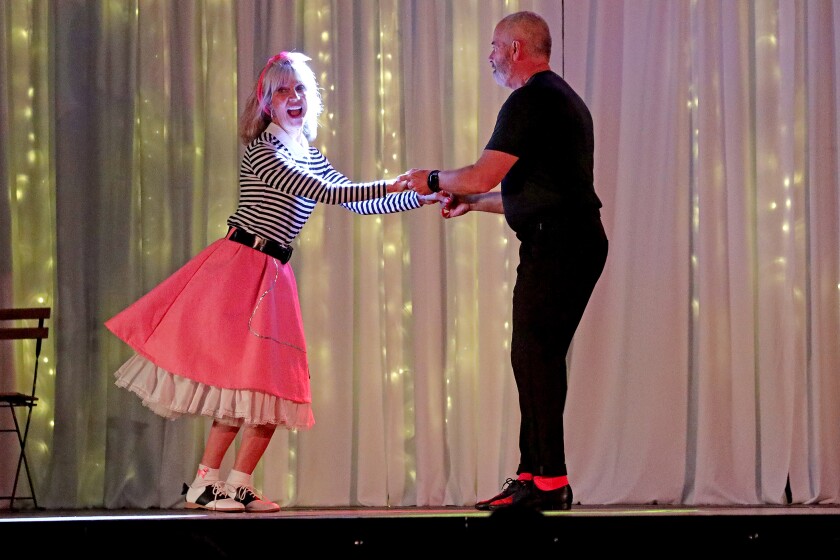 Dancer perform on stage.