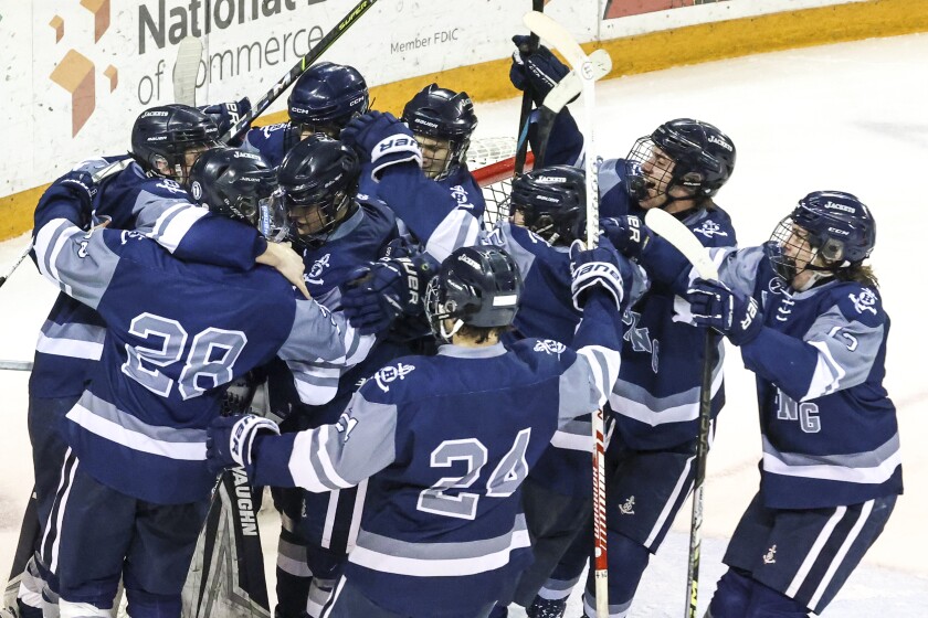 high school boys play ice hockey