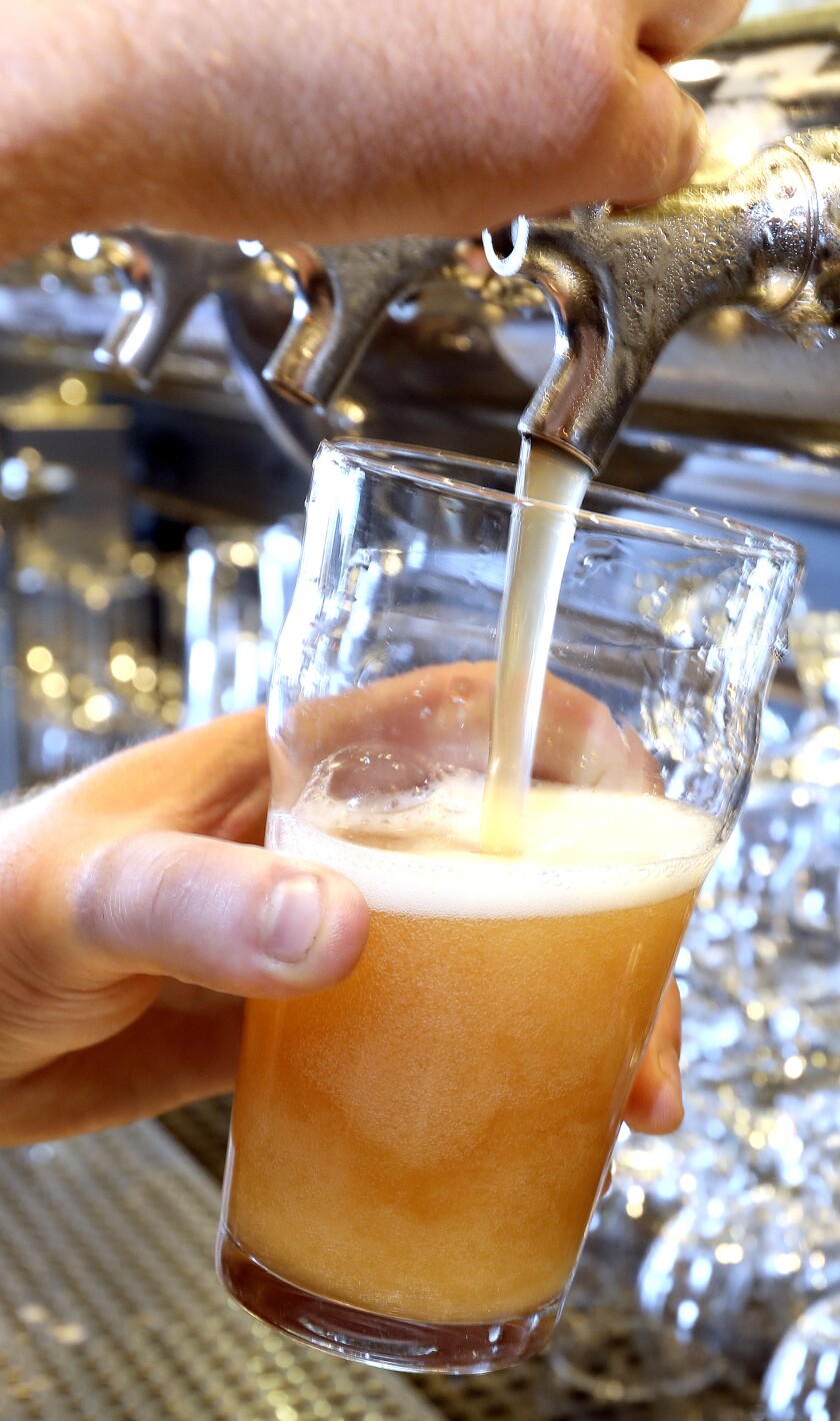 T07.24.2017 -- Steve Kuchera -- 072617.F.DNT.AllPintsNorthC2 -- Ryan Woodfill fills a glass with a strawberry beer at Canal Park Brewing. He’ll be pouring the beer at All Pints North. Steve Kuchera / skuchera@duluthnews.com