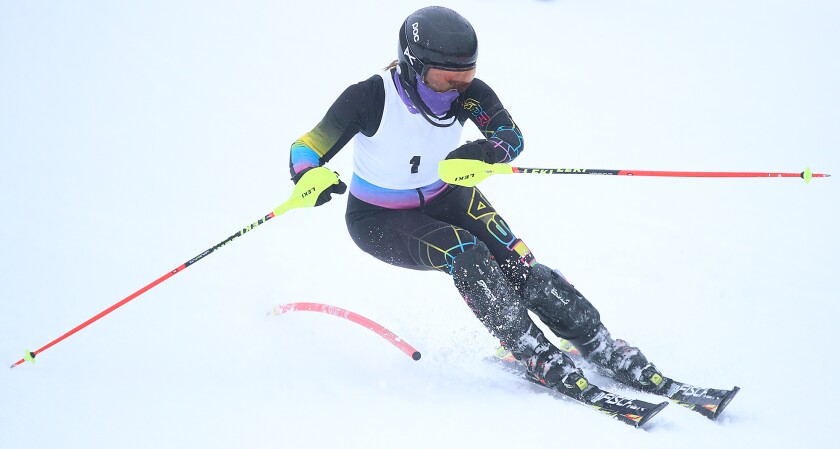 Rock Ridge’s Mia Schuchard (1) bends a gate during her run