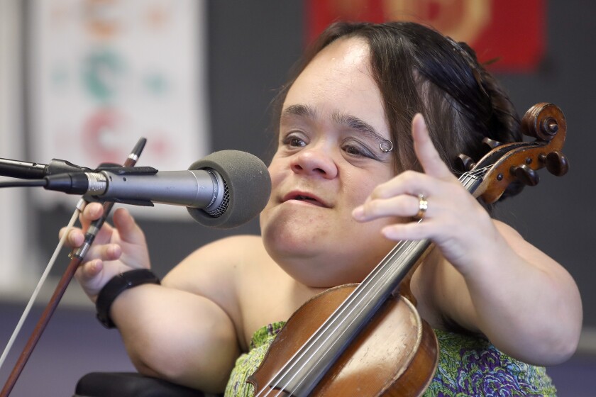 Gaelynn Lea performs a song for students at Cloquet’s Churchill Elementary School.