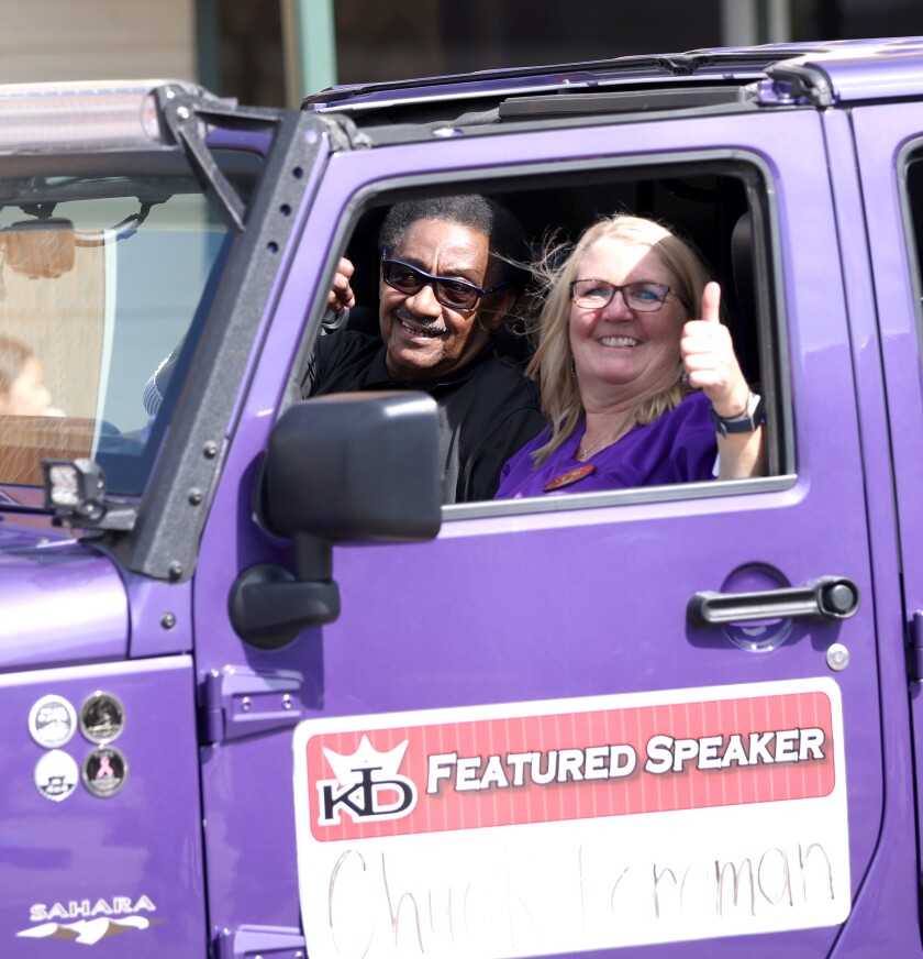 King Turkey Day featured speaker and former Minnesota Vikings player Walter Eugene "Chuck" Foreman, known as "The Spin Doctor," waves to the crowd with Lisa Schutte during the parade on Saturday, Sept. 17, 2022.