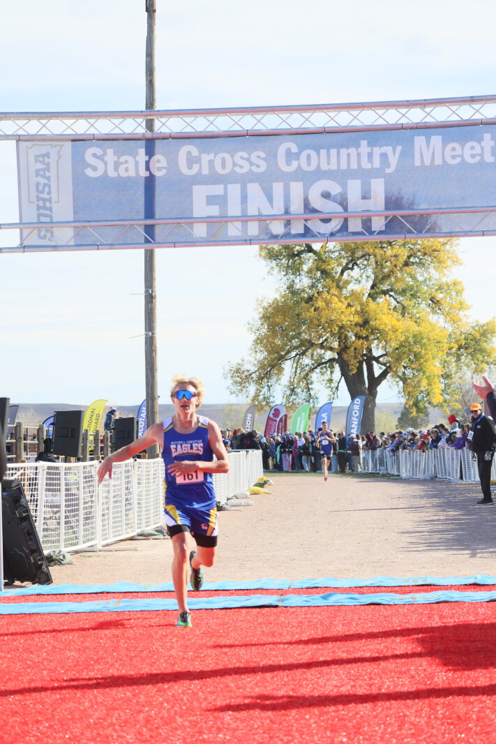 Comunication Racks Silas Holdeman, Mitchell Christian boys sweep titles at Class B state ...